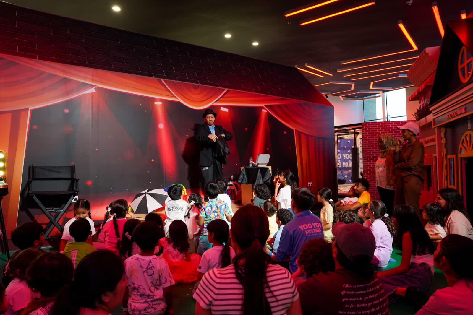 Kids enjoying a magician show at a birthday party at YOOYOO KIDS PARK