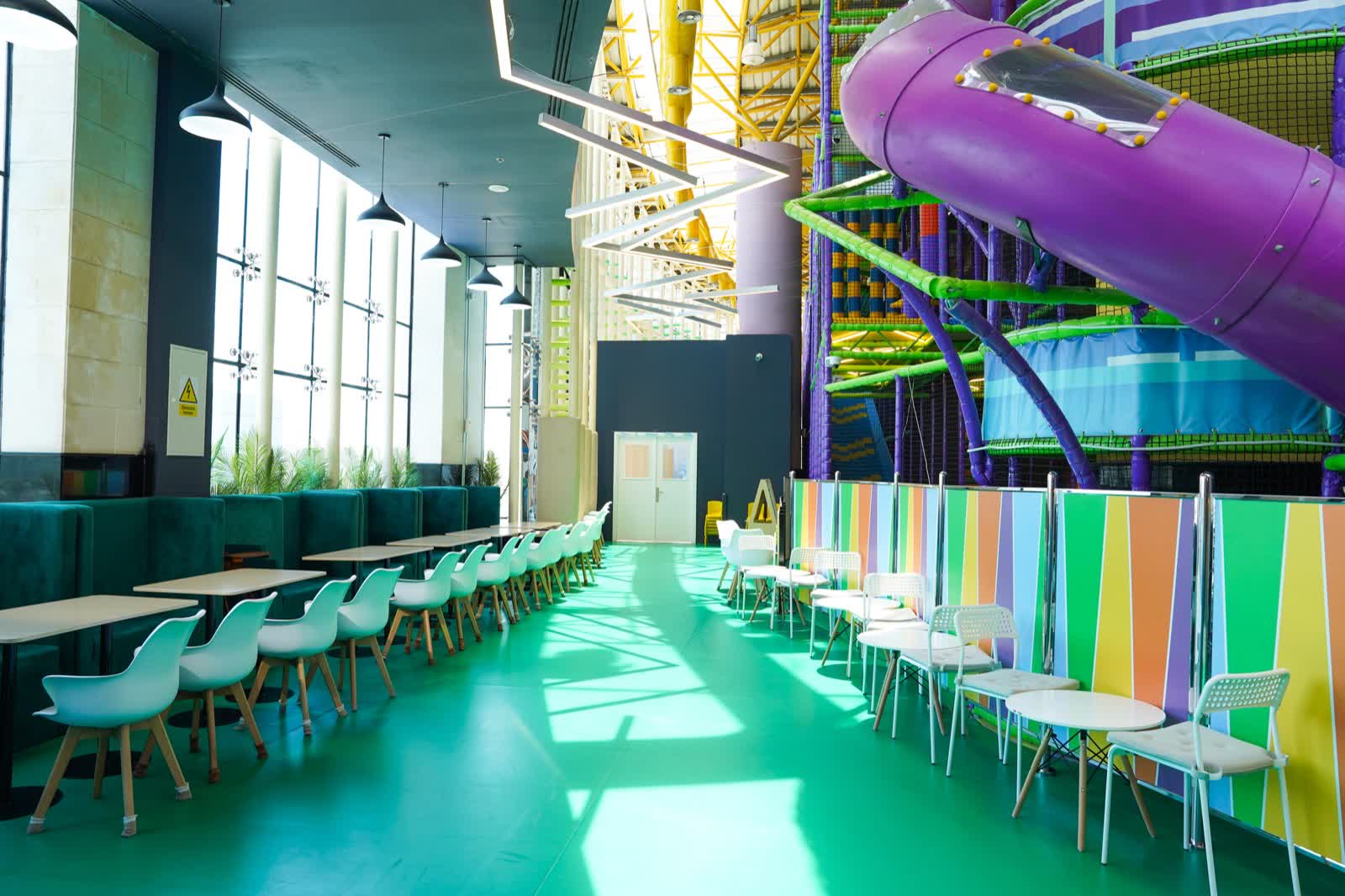 Bright YOOYOO Cafe seating beside the indoor play area