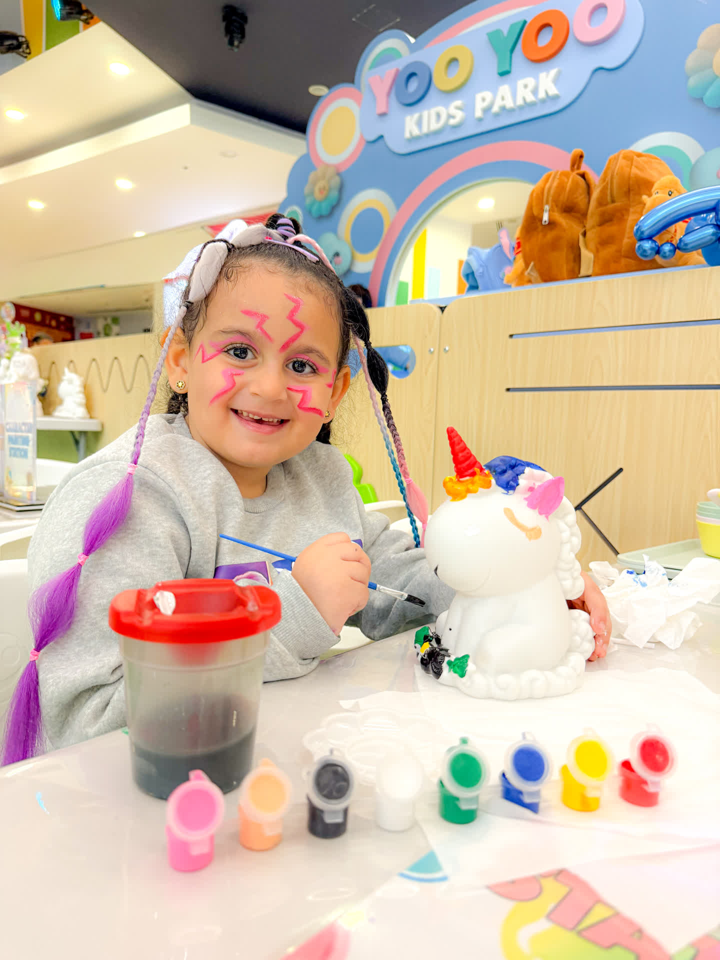 Child painting a character design